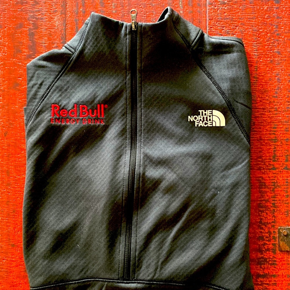 Light The North Face jacket with Red Bull logo. Like new. Size Medium.